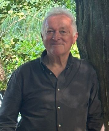 Stanislaw Lazarek in front of tree