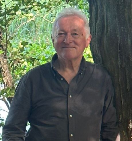 Stanislaw Lazarek in front of tree